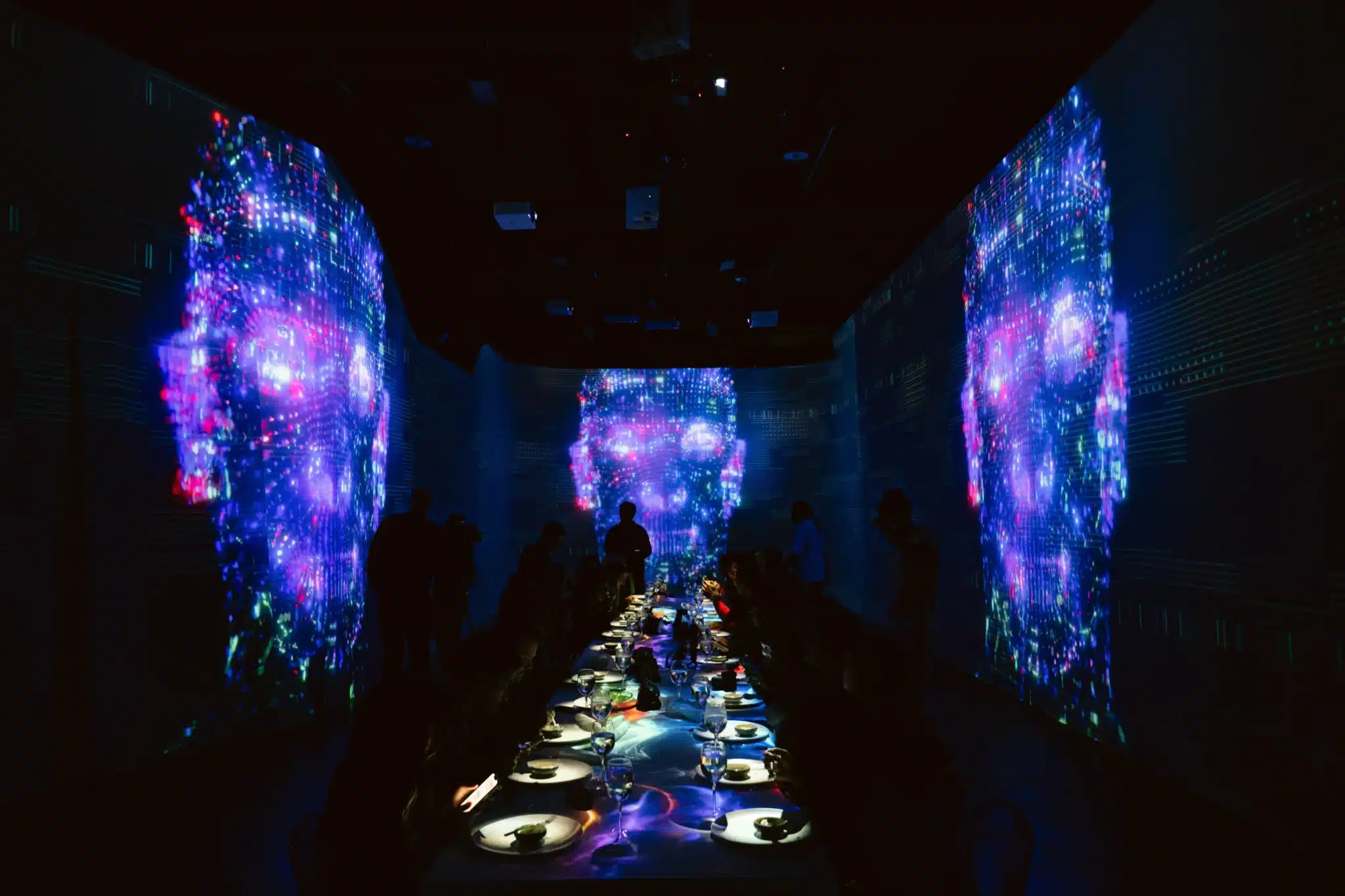 Ambient projection mapping filling a dark venue with layered light